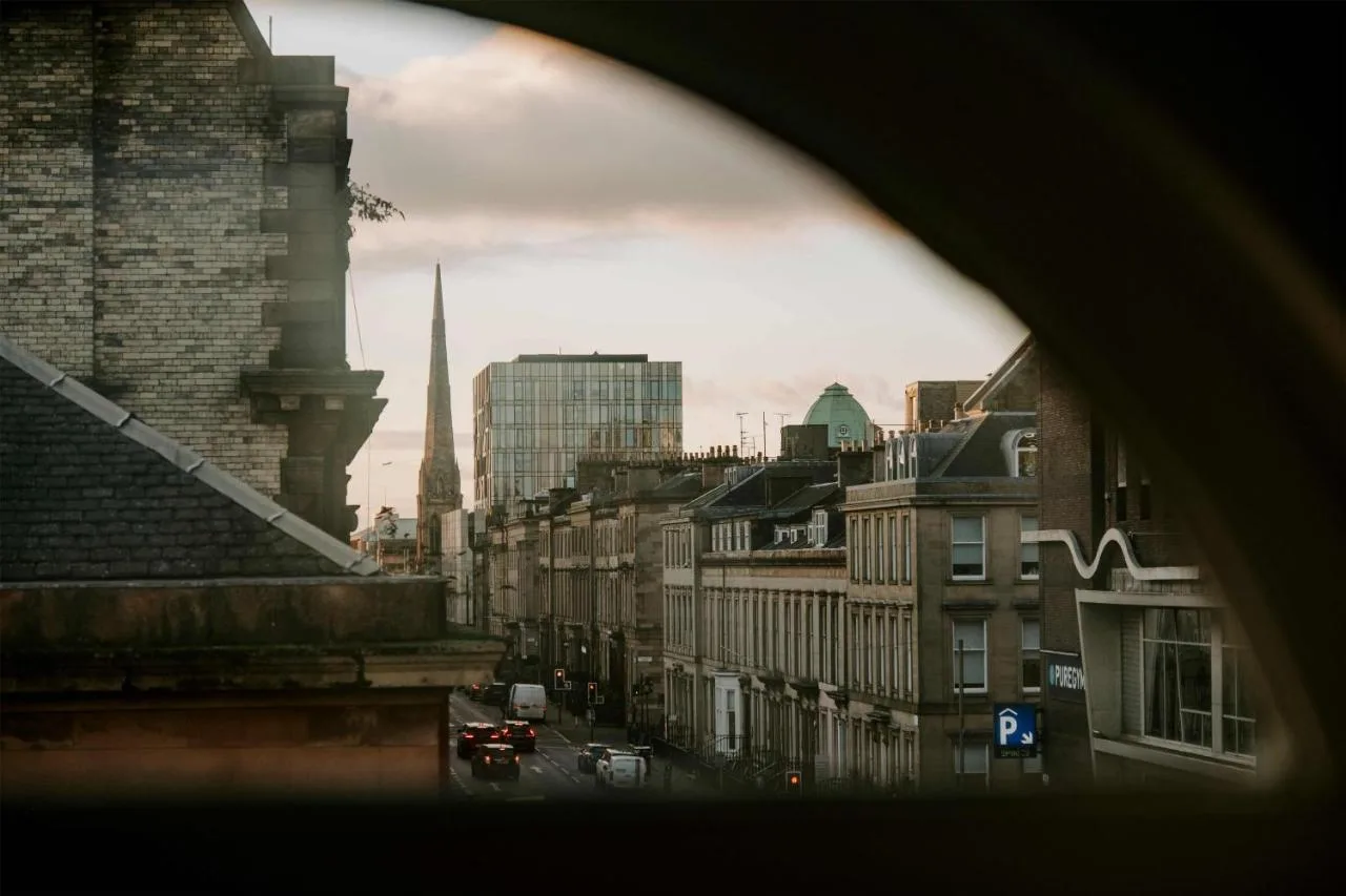 A city view over Glasgow from a window at The Wellington Glasgow by Adina